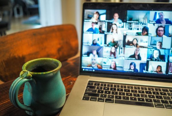 macbook pro displaying group of people